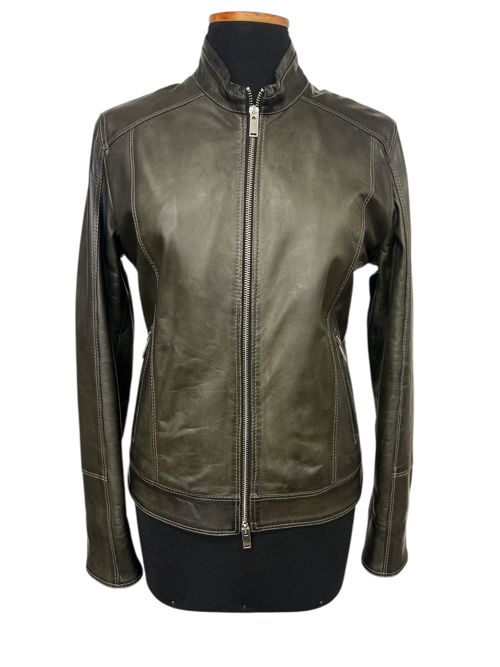 Olive green leather jacket with front zipper and contrast stitching, displayed on mannequin