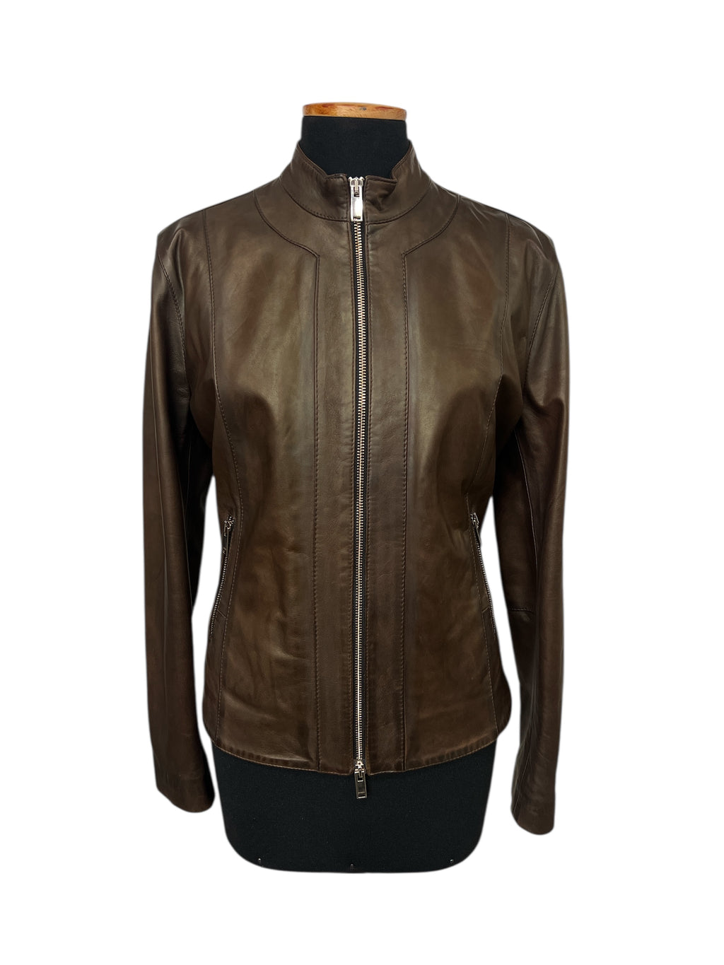 Brown leather jacket with front zipper and side pockets, displayed on mannequin for stylish women's fashion