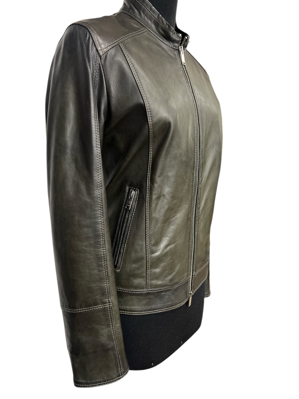 Olive green leather jacket with front zipper and side pocket, stylish and modern design for women