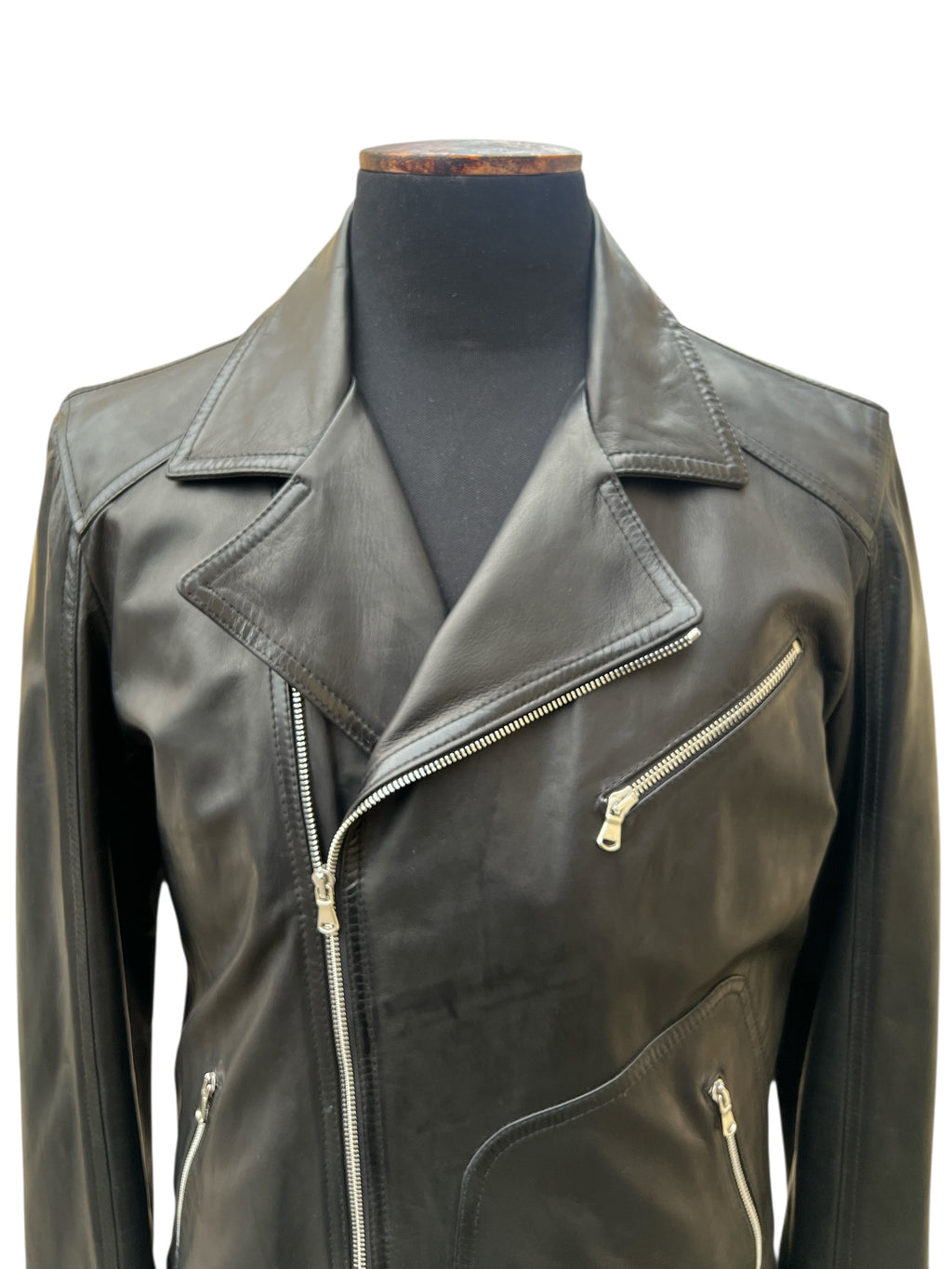 Black leather biker jacket with zippers, stylish and modern for women's fashion