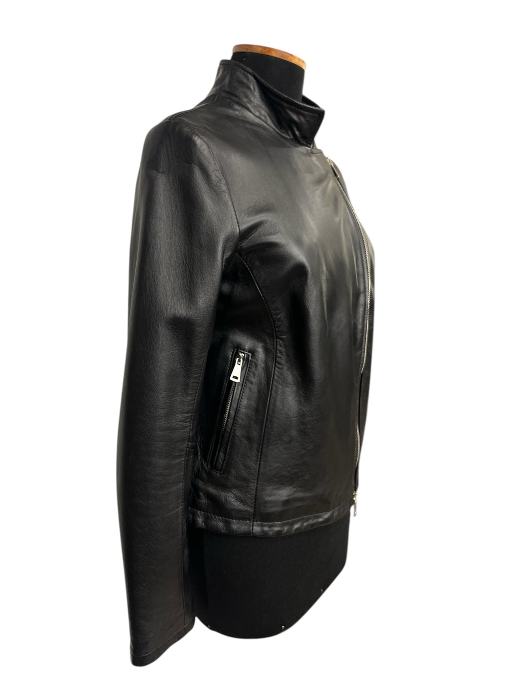 Black leather jacket with zipper pockets and high collar, stylish women's fashion outerwear